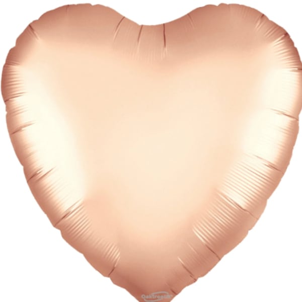 Heart-shaped peach foil balloon on a white background