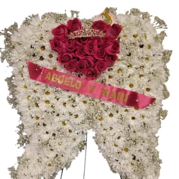 Heart-shaped floral wreath with pink roses and a pink ribbon