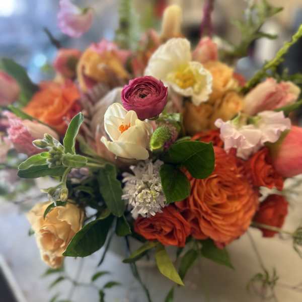 Mixed bouquet with orange, pink, and white flowers