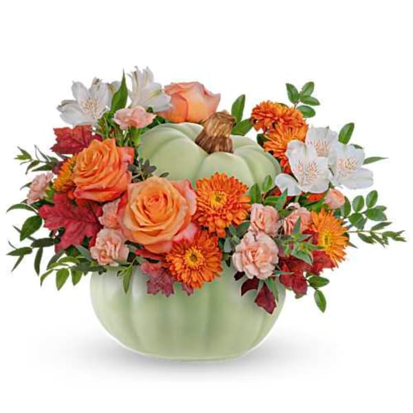 Pumpkin-shaped vase with orange and white flowers