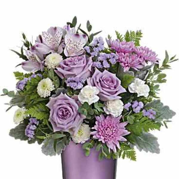 Lavender and pink bouquet in a purple glass vase