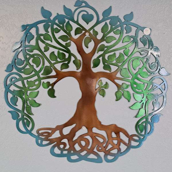 Decorative metal tree wall art with blue and green leaves