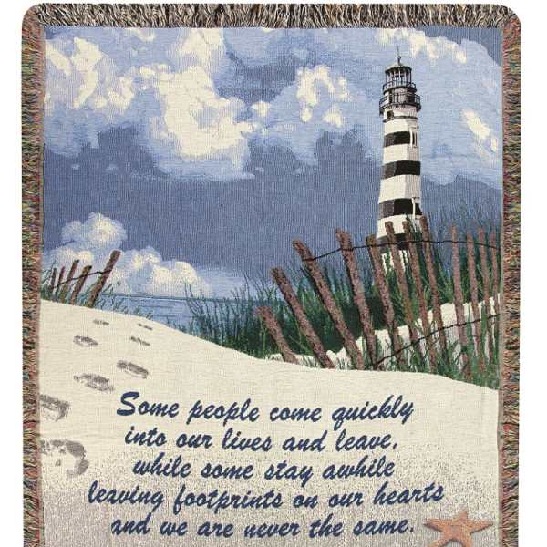 Woven blanket with a lighthouse scene and memorial quote