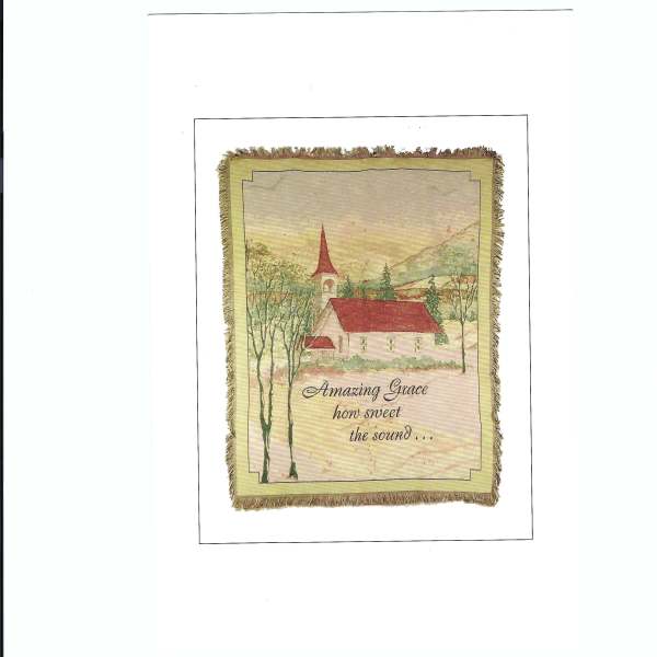 Framed wall hanging with a church scene and the text "Amazing Grace"