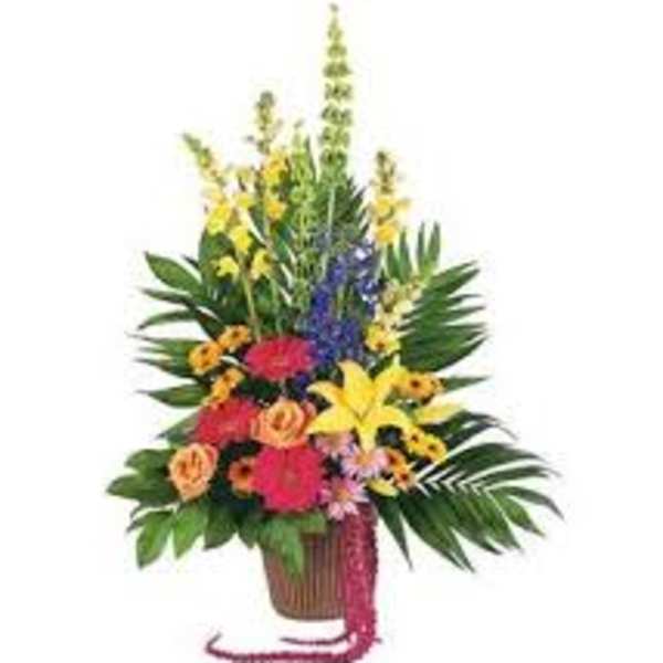 Tropical flower arrangement in a basket with bright mixed blooms
