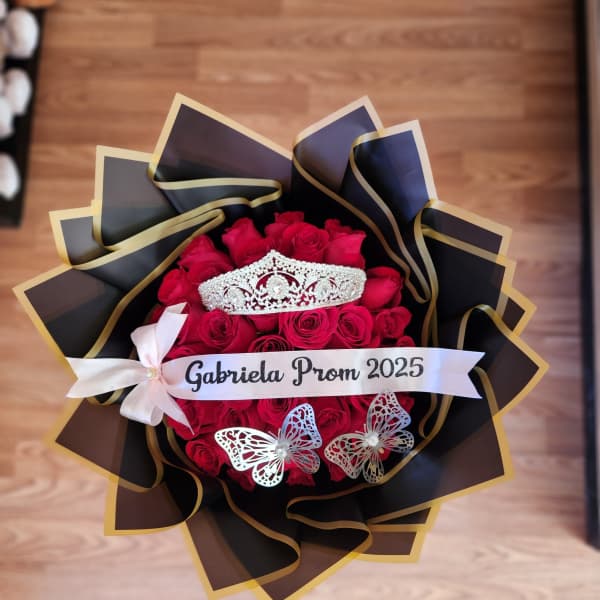 Red rose bouquet with a tiara and prom ribbon