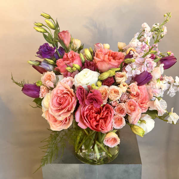 Mixed pink and purple bouquet in a glass vase