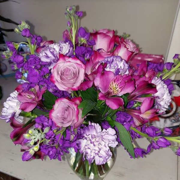Pink and purple bouquet in a glass vase