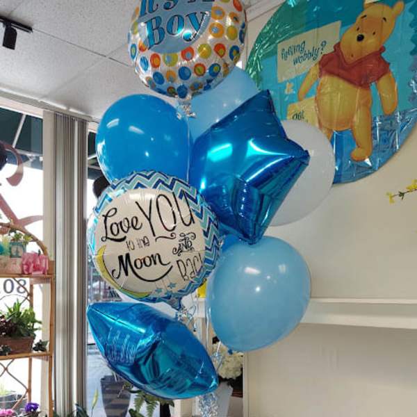 Blue baby shower balloon bouquet with a Winnie the Pooh balloon