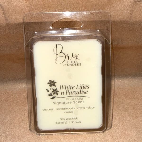 Packaged white wax melt in a clear plastic clamshell