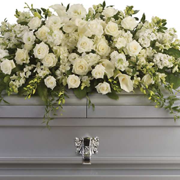 White floral casket spray with roses and calla lilies