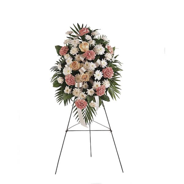 Standing floral spray with pink and white flowers on an easel