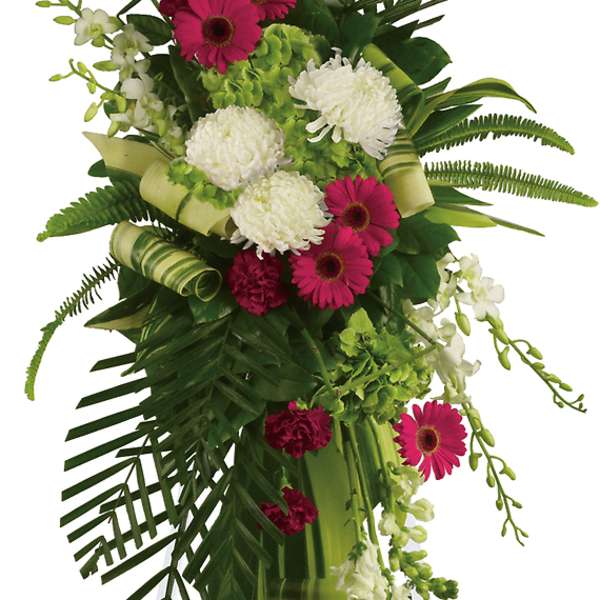Tall standing floral spray with pink and white flowers on an easel