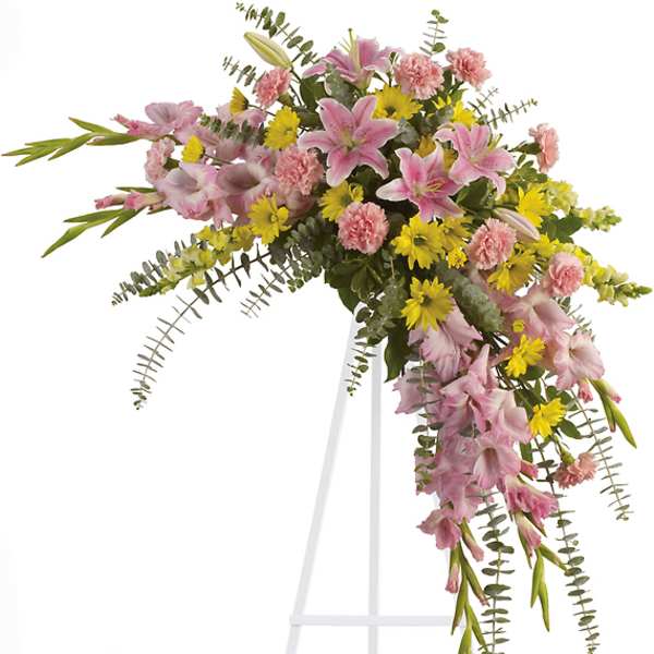 Pink and yellow floral spray on a white easel