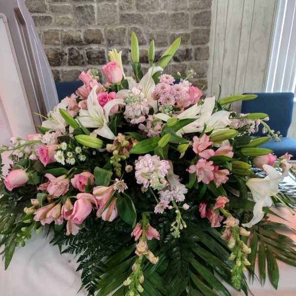 Large pink and white floral spray with lilies and roses