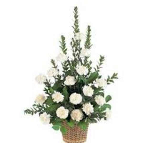 White flower arrangement in a woven basket