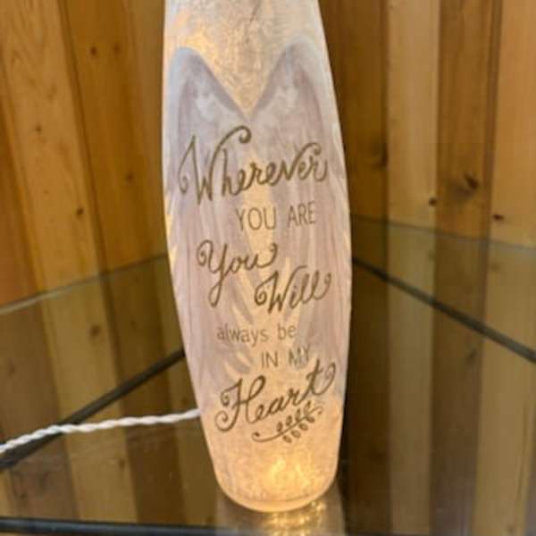 Decorative glass candle holder with a printed quote