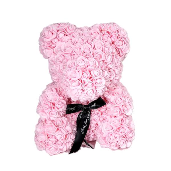 Pink teddy bear made of roses with a black ribbon