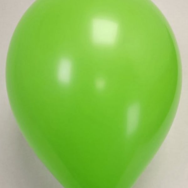 Single bright green balloon on a plain background