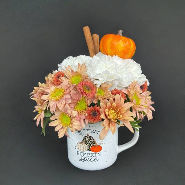 Mug arrangement of peach and white chrysanthemums with a pumpkin topper