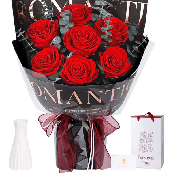 Bouquet of red roses wrapped in black paper with a ribbon bow