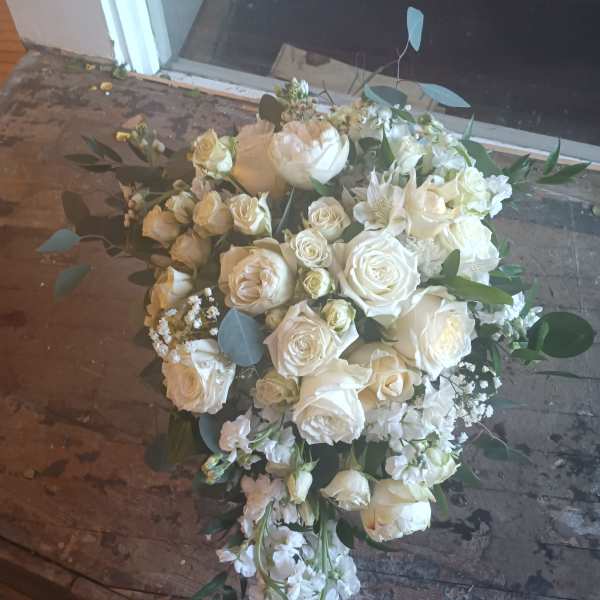 White rose bouquet with eucalyptus and small white filler flowers