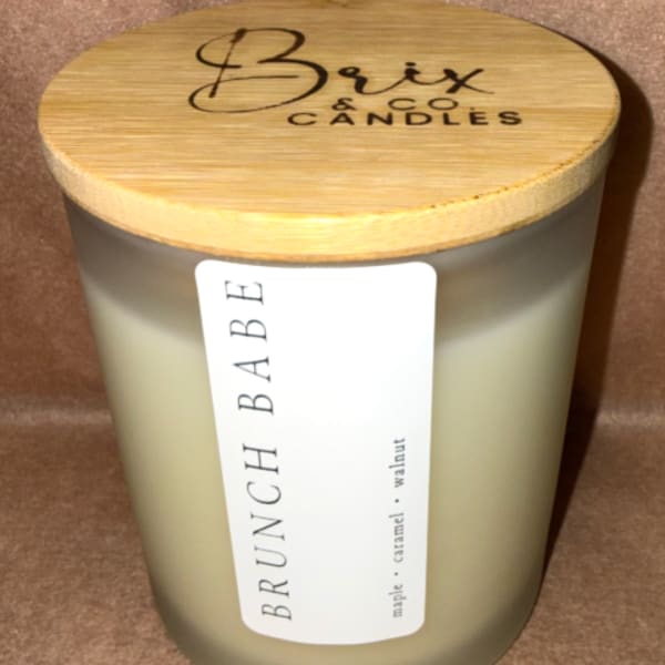 Brunch Babe candle in a frosted glass jar with a bamboo lid