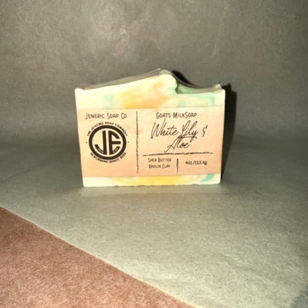 Bar of handmade soap in a paper label wrapper