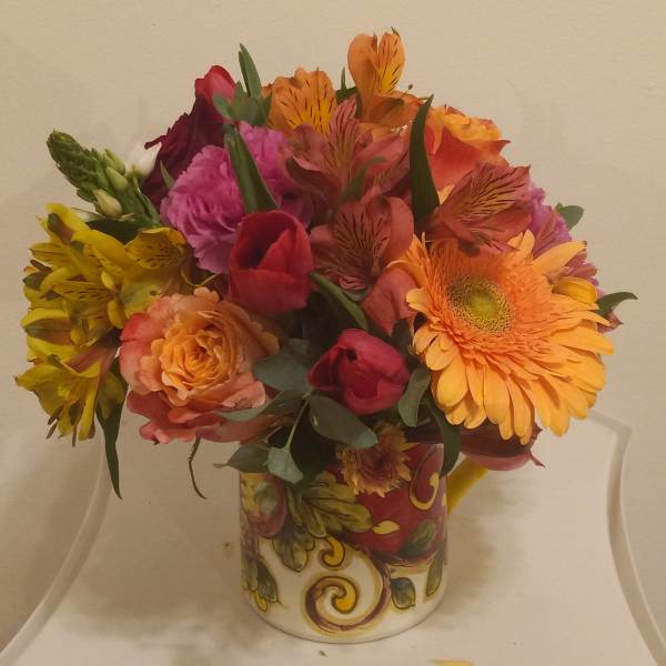 Colorful mixed bouquet in a decorative ceramic vase