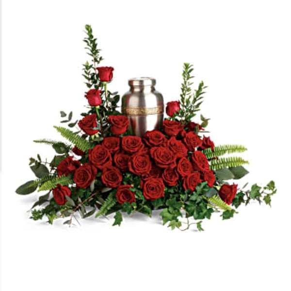 Red rose arrangement with a silver urn centerpiece