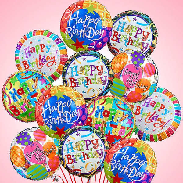 Cluster of colorful Happy Birthday balloons on a pink background