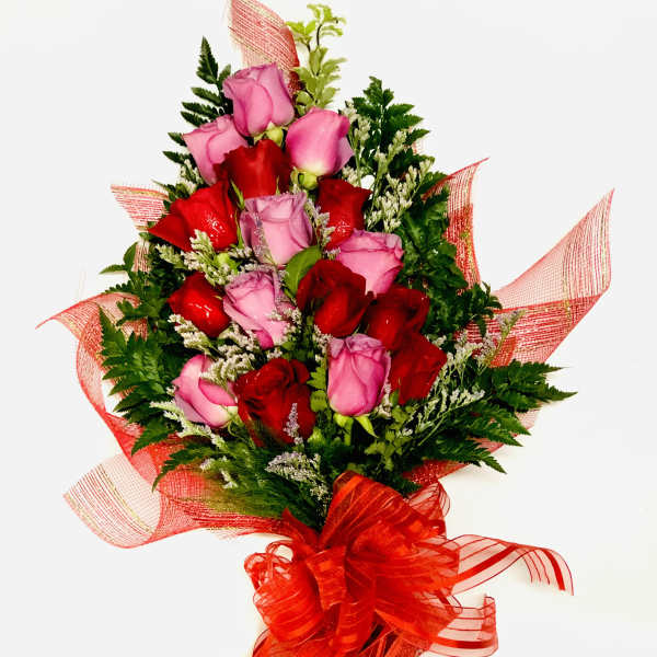 Bouquet of red and pink roses with red ribbon wrap