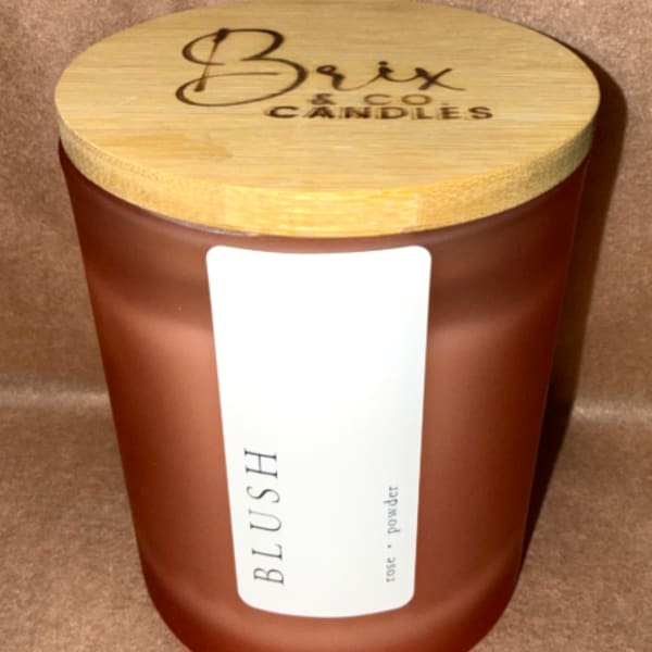 Brown candle jar with a wooden lid labeled Brix & Co Candles