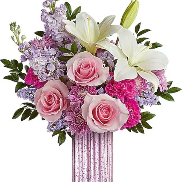 Pink roses and white lilies in a tall pink vase