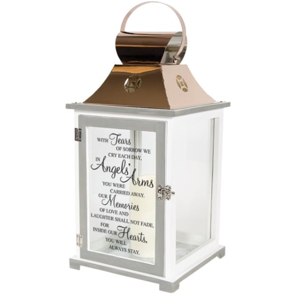 White memorial lantern with metallic top, handle, and remembrance quote on the glass door