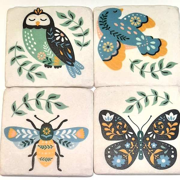 Four decorative tiles with stylized owl, bird, bee, and butterfly designs