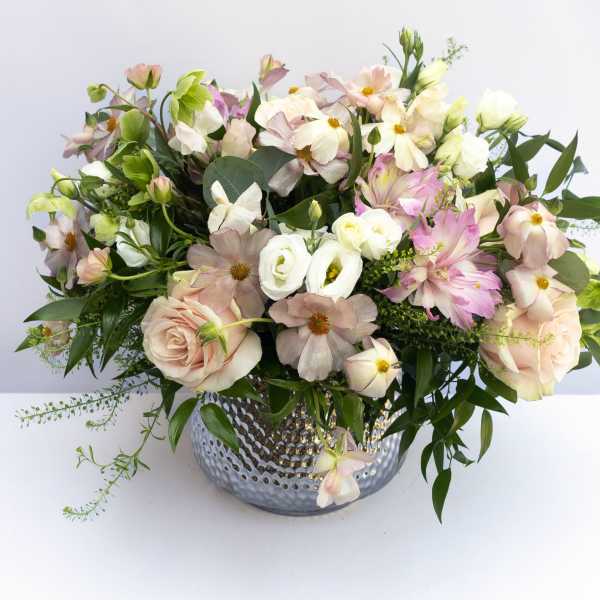 Blush and white mixed bouquet in a silver vase