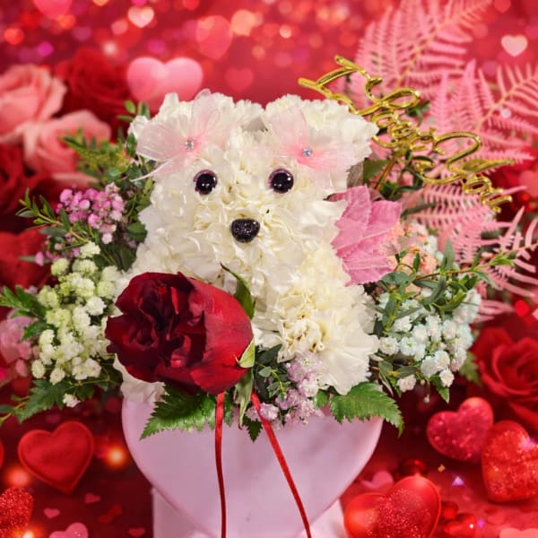 Heart-themed flower arrangement with a teddy bear face and red rose