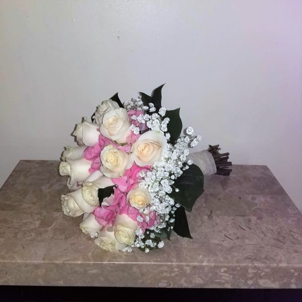 Bouquet of white and pink roses with baby's breath