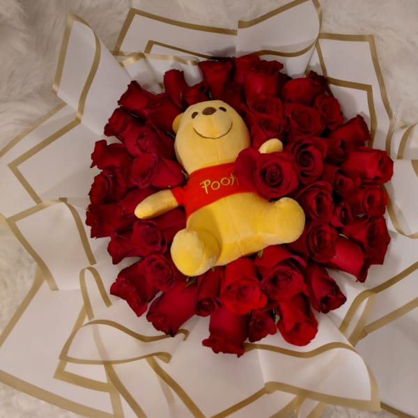 Winniepooh bouquet whit chocolate.