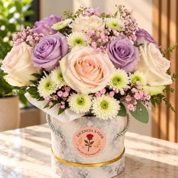 Bouquet of lavender and blush roses in a marble-look hat box
