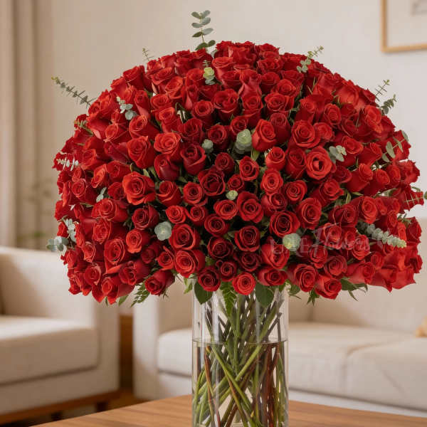 Large bouquet of red roses in a clear glass vase