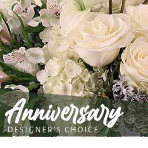 Arrangement of white roses, lilies, hydrangeas, and alstroemeria with Anniversary text overlay
