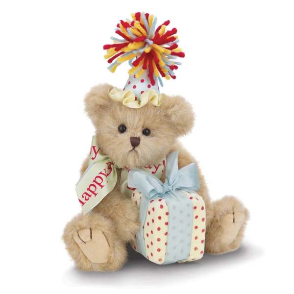 Teddy bear with a party hat and wrapped gift