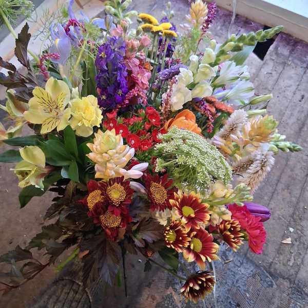 Mixed bouquet with colorful flowers in a loose hand-tied arrangement