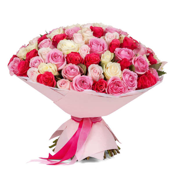 Large bouquet of pink, red, and white roses wrapped in pale pink paper