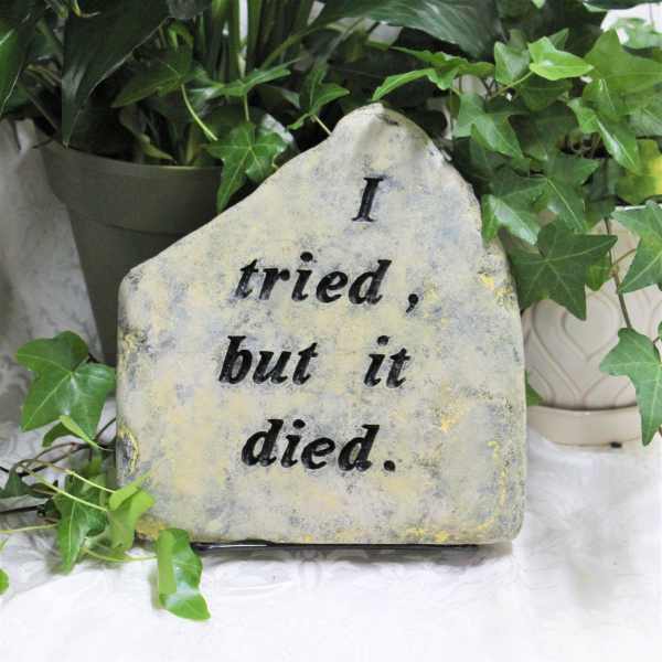 Decorative stone sign with ivy and the words "I tried, but it died."