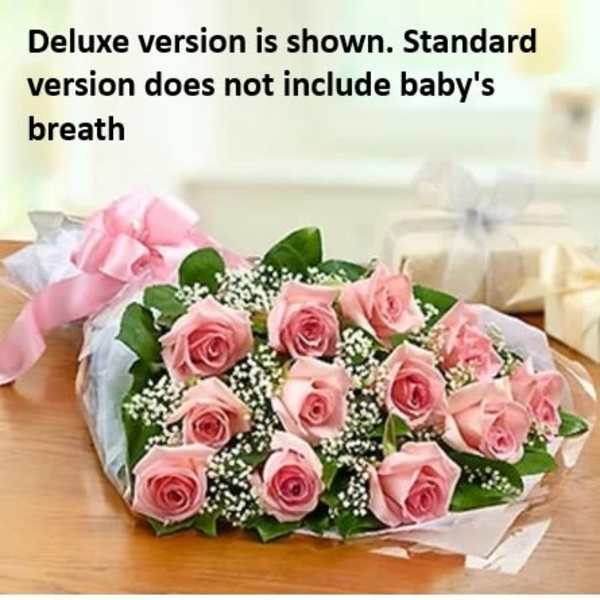 Bouquet of pink roses with baby's breath and ribbon wrapping