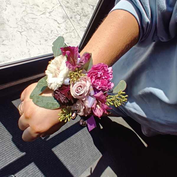 Handheld bouquet with pink and white flowers and eucalyptus
