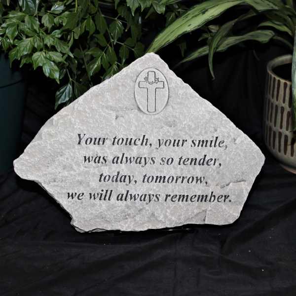 Memorial stone with a cross and remembrance message